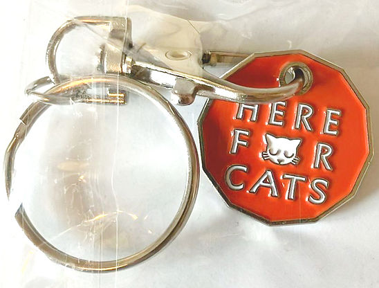 Here For Cats trolley token keychain included in the welcome pack